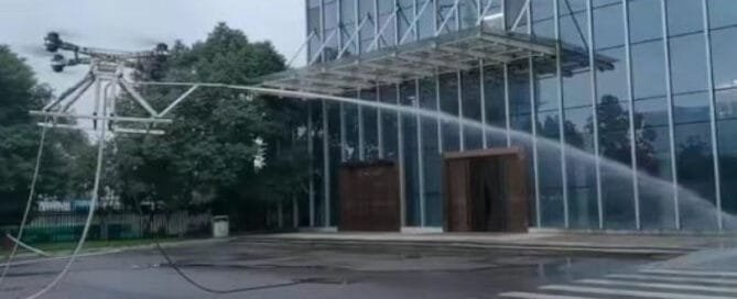 D-QX60 drone for high-altitude glass curtain wall cleaning with a tethered high-pressure spray system
